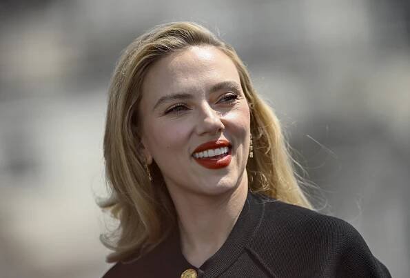 Scarlett Johansson with a side part smiling
