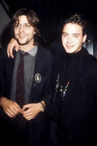 two young men standing next to each other