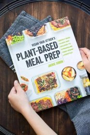Hands holding a meal prepping cookbook with containers of food on the cover