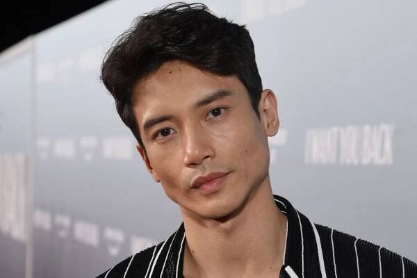 Manny Jacinto at the "I Want You Back" drive-in premiere held at Skylight ROW DTLA on February 8, 2022 in Los Angeles, California.