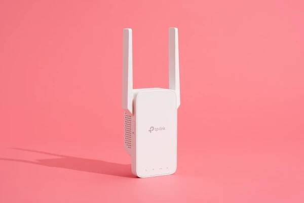 The TP-Link RE315, our pick for best Wi-Fi range extender, standing up with its two antennae extended.
