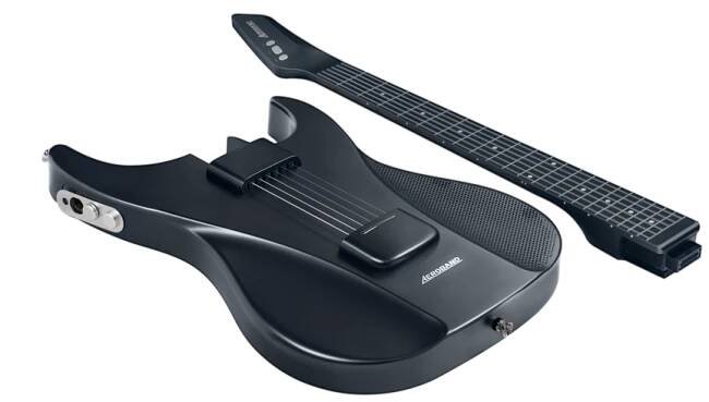 AeroBand smart guitar body with detached neck, showcasing silicone strings and MIDI controller.