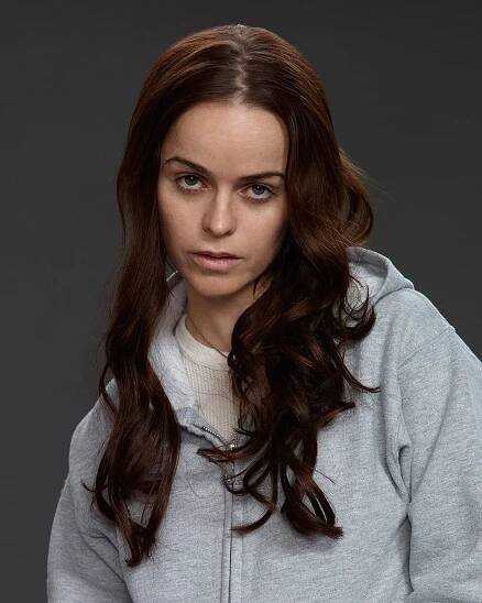 Taryn Manning looking out of it, looking at the camera. 