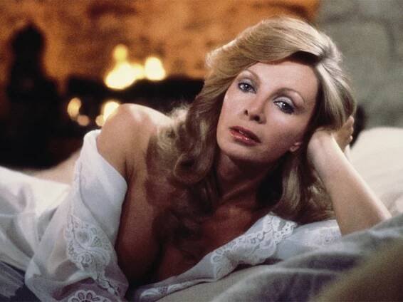 Cassandra Harris in a white nightgown