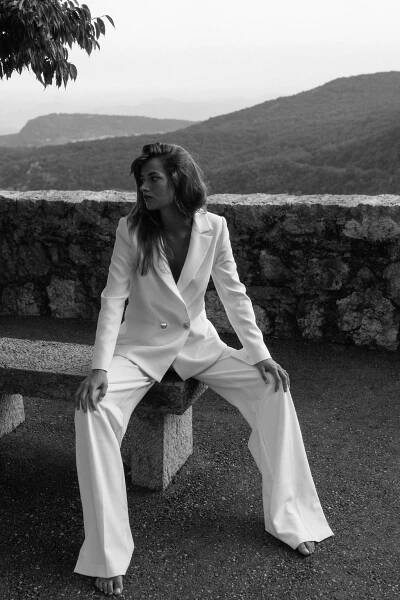 Model Ben Simmons wears the Charlie Danielle bridal suit separates, from the Elope collection by Karen Willis Holmes.
