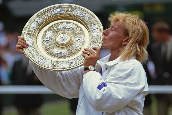 Navratilova of the United States kisses the Venus Rosewater Dish after defeating Zina Garrison in their Women's Singles Final match at the Wimbledon Lawn Tennis Championship on 7 July 1990