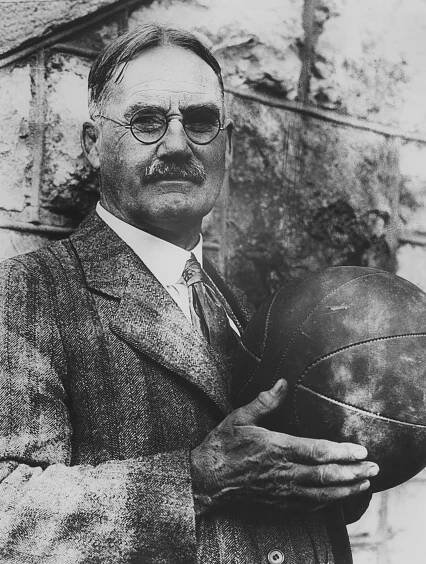 Dr. James Naismith is known as the "Father of Basketball" for he invented the game in 1891, at the Springfield, Mass. Y.M.C.A. College. At present , the doctor is professor of physical education at the University of Kansas, where he still shoots enough baskets to keep in good physical trim, as photo will testify. (AP PHOTO)  December 13, 1929