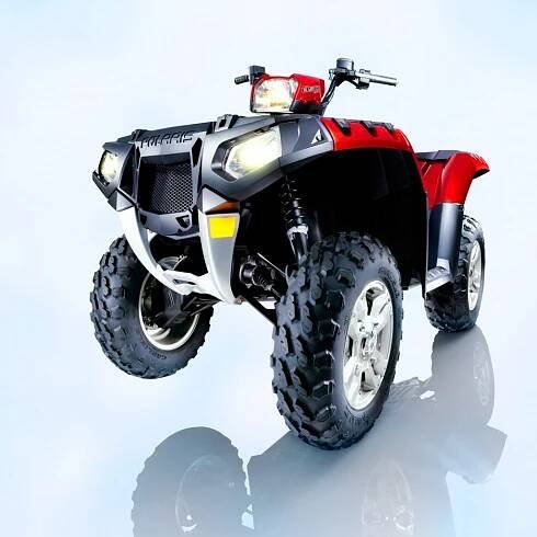 Dramatic studio image of red Polaris Sportsman 850 ATV, by Cords Photography