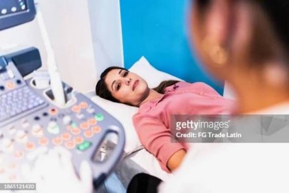 mid adult woman on ultrasound exam at hospital - pelvic exam stock pictures, royalty-free photos & images