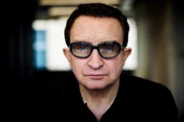 Eddie wears sunglasses by Gentle Monster, polo by Dunhill.