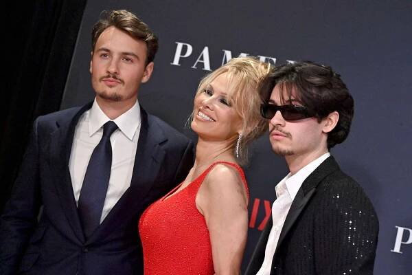 Brandon Thomas Lee, Pamela Anderson, and Dylan Jagger Lee on the red carpet