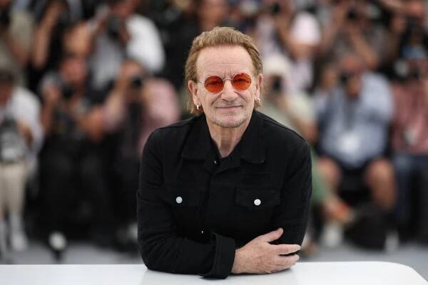 Bono poses during a photocall for the film "Bono: Stories of Surrender" at the 2025 Cannes Film Festival