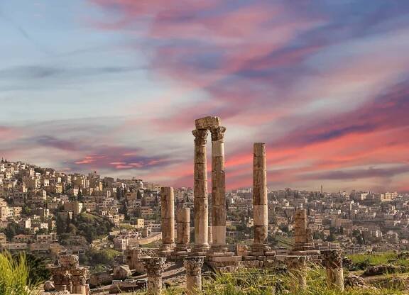 Amman city landmarks, old roman Citadel Hill, Jordan. Against the background of a beautiful sky with clouds 
