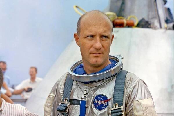 A portrait of Thomas P. Stafford, a balding man with a serious expression wearing an astronaut's uniform with the NASA logo visible on the left side of his chest.