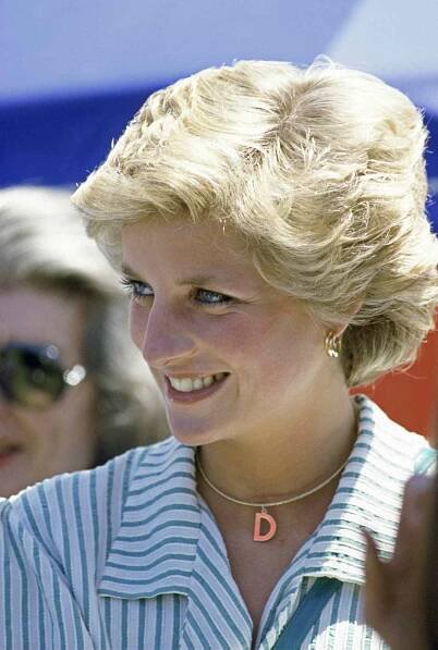Prince Diana in a blue and white striped outfit