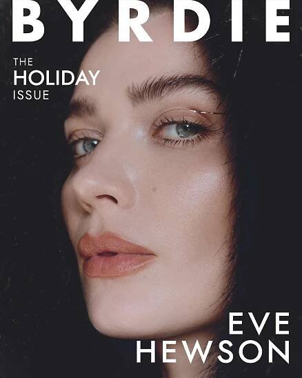 Eve Hewson staring directly into the camera with a black fur hood