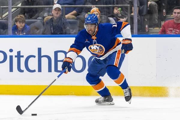 Anthony Duclair #11 of the New York Islanders moves the puck down ice during the first period at UBS Arena, Saturday, Dec. 28, 2024, in Elmont, NY. 