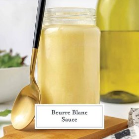 jar of beurre blanc sauce with a spoon resting on the side 