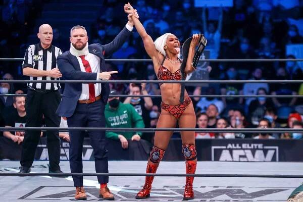 Pictured: (L-R) Mark Sterling raising the hand of Jade Cargill during the 'AEW Dynamite - Beach Break' taping in Cleveland, Ohio, in 2022.