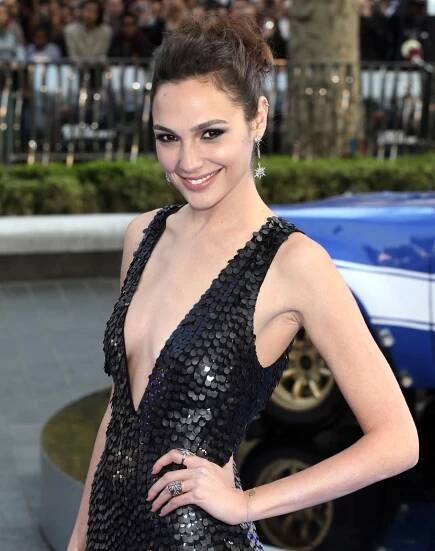 Gal Gadot sparkles in a plunging black sequin dress at the Fast & Furious 6 London premiere