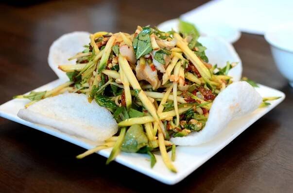 Green mango and snail salad at Oc & Lau in Garden Grove.