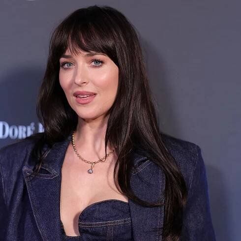Dakota Johnson Carries a Massive Watermelon in the Dreamiest Fall ’Fit
