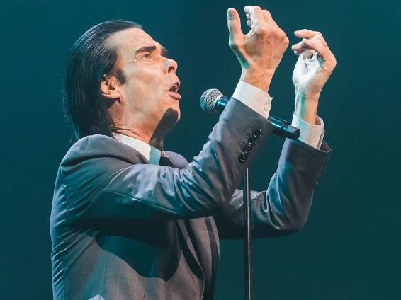 Nick Cave, No Longer So Angry About AI, Shares New “Tupelo” Video Starring an AI Elvis: Watch