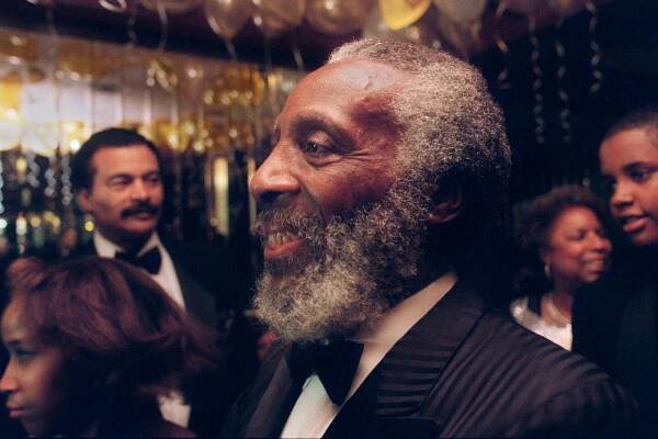 Dick Gregory attends a 50th-anniversary party for actor-activists Ruby Dee and Ossie Davis at a New York hotelin 1998.