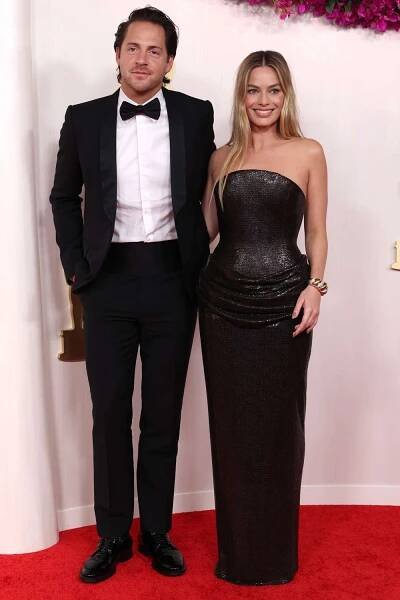 Tom Ackerley and Margot Robbie attend the 96th annual Academy Awards on March 10, 2024