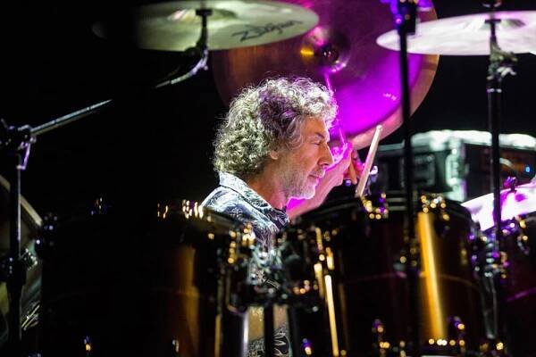 Simon Phillips close up playing drums during Protocol 4 Live concert