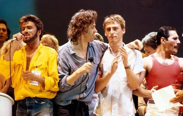 George Michael, Bob Geldof, Paul Weller, and Freddie Mercury performing at Live Aid.
