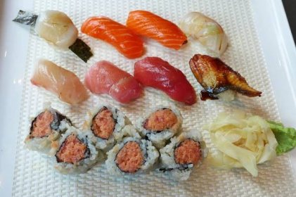 Three rows of glistening sushi.
