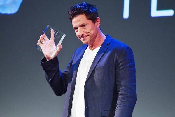 Simon Rex accepts the Spotlight Award onstage during the 24th SCAD Savannah Film Festival on October 26, 2021 in Savannah, Georgia.