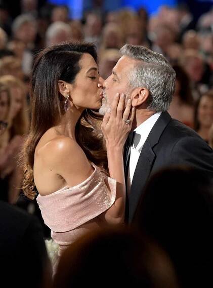 George and Amal Clooney Share a Kiss Before Gushing About Their 'Perfect' Twins