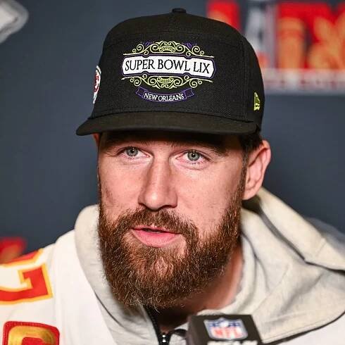 Travis Kelce admits he is 'giddy' introducing Taylor Swift as his fiancée