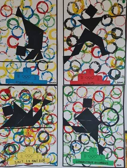 three different colored paper cut outs with olympic symbols