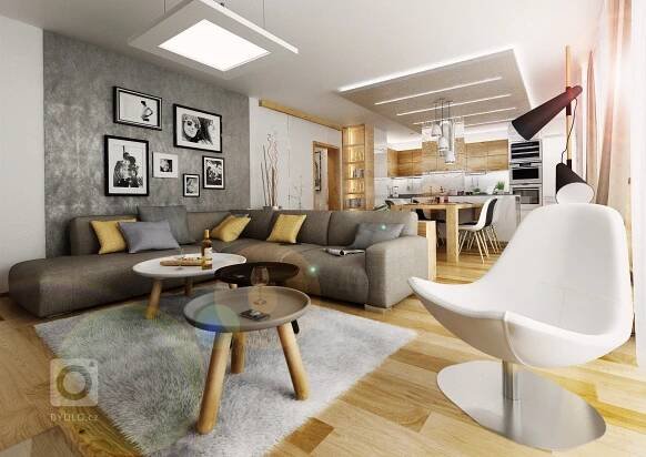 a living room filled with furniture and pictures on the wall