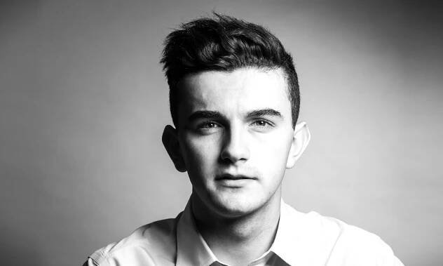 Model headshot in black and white.