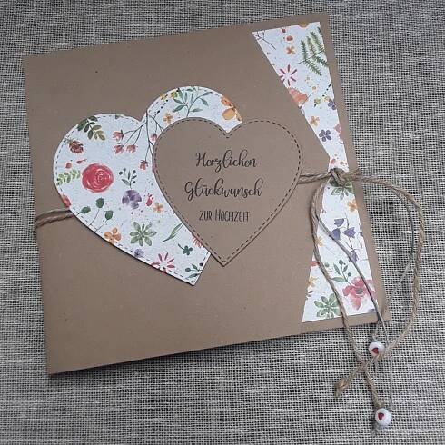 a brown card with two hearts on it