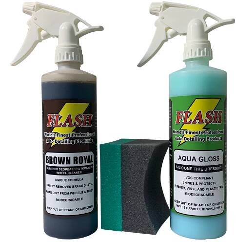 Two spray bottles with a sponge in between on a white background.