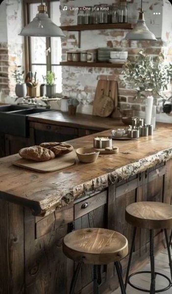 a kitchen with wooden counter tops and stools