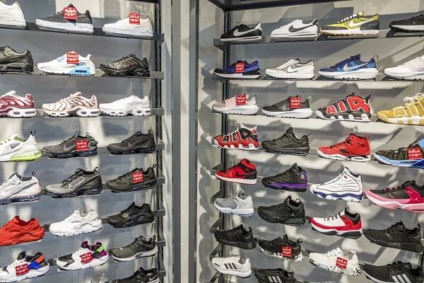 Shoes at Foot Locker on display.
