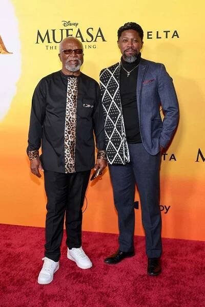HOLLYWOOD, CALIFORNIA - DECEMBER 09: (L-R) John Kani and Atandwa Kani attend the Los Angeles premiere of Disney's 