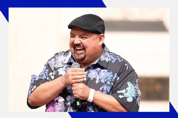 Gabriel Iglesias laughs while telling jokes onstage.