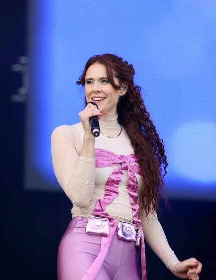 Kate Nash performing at a music festival.