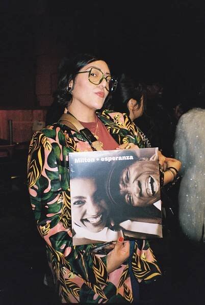 Ro "Wyldeflower" Contreras of KCRW holds the 2024 album "Milton + esperanza," nominated for a Grammy.