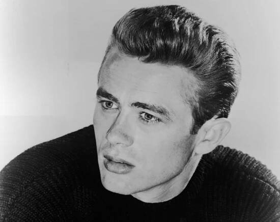 Portrait of American film actor James Dean dressed in a dark-colored sweater, early 1950s.