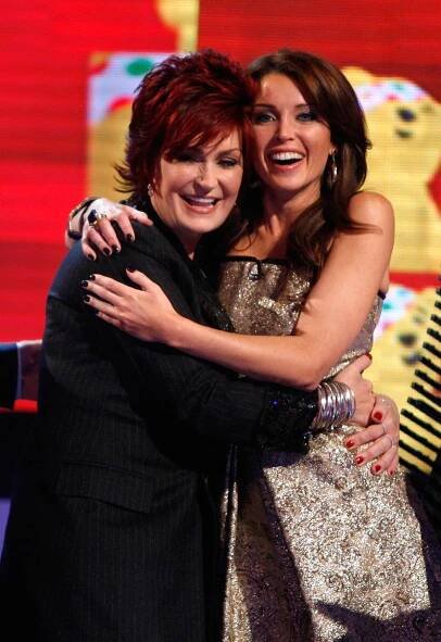 Sharon Osbourne and Dannii Minogue hugging during a Children in Need telethon.