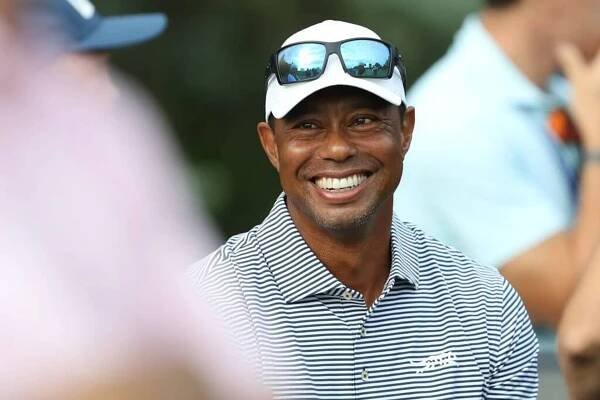 Tiger Woods of the United States talks with spectators near the putting green on day one of the 76th U.S. Junior Amateur Championship on the North Course at Oakland Hills Country Club on July 22, 2024 in Bloomfield Hills, Michigan. 