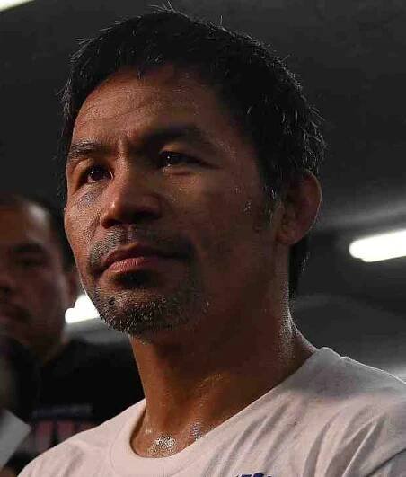 Manny Pacquiao works out during media day on June 25,...